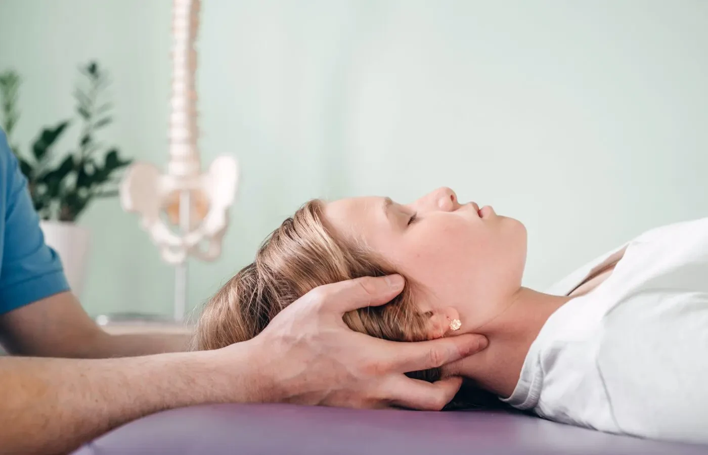 Reiki healing session — practitioner placing hands gently above a client